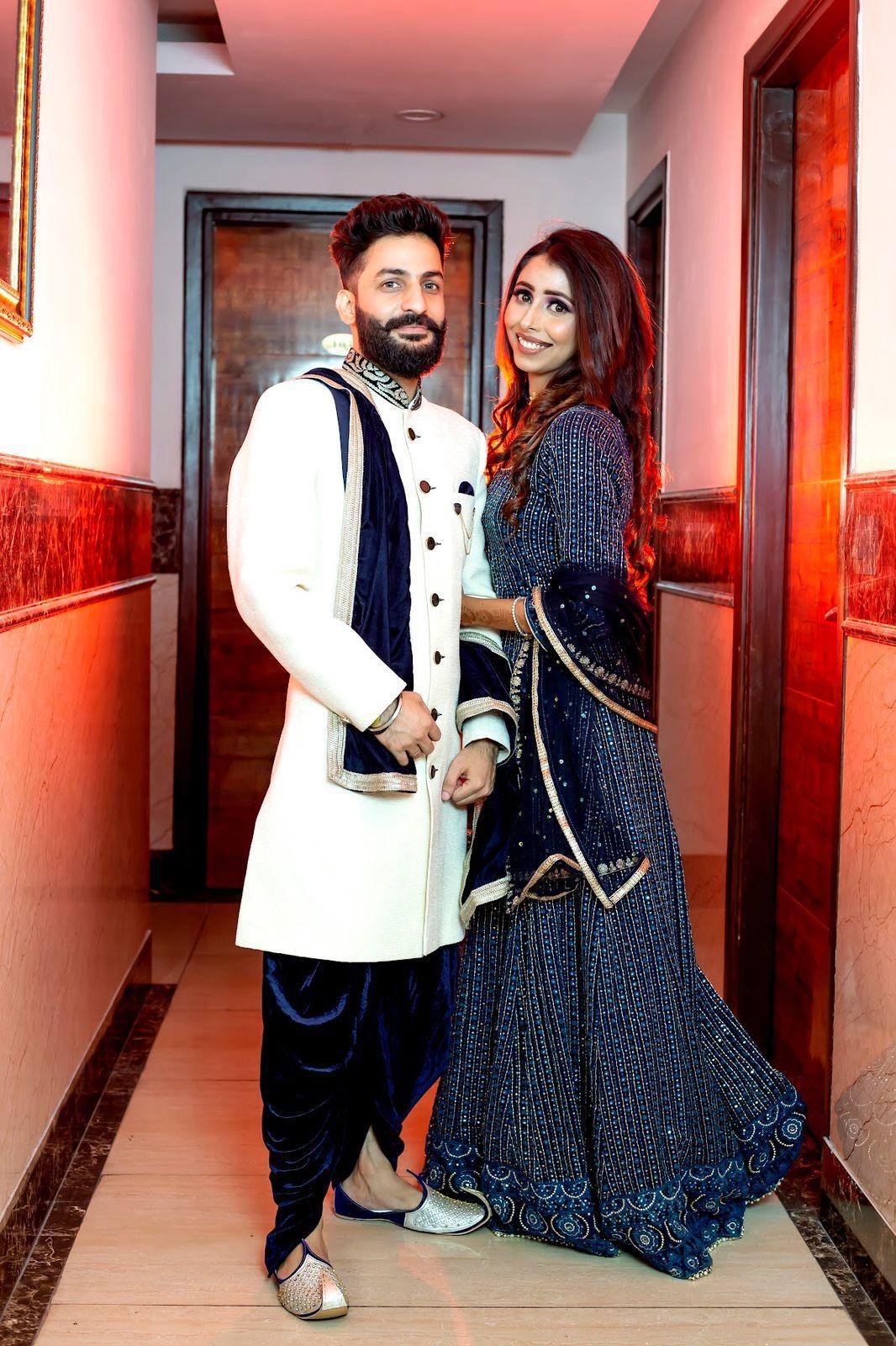Couple styled for a reception — navy and cream formal look with HD bridal makeup